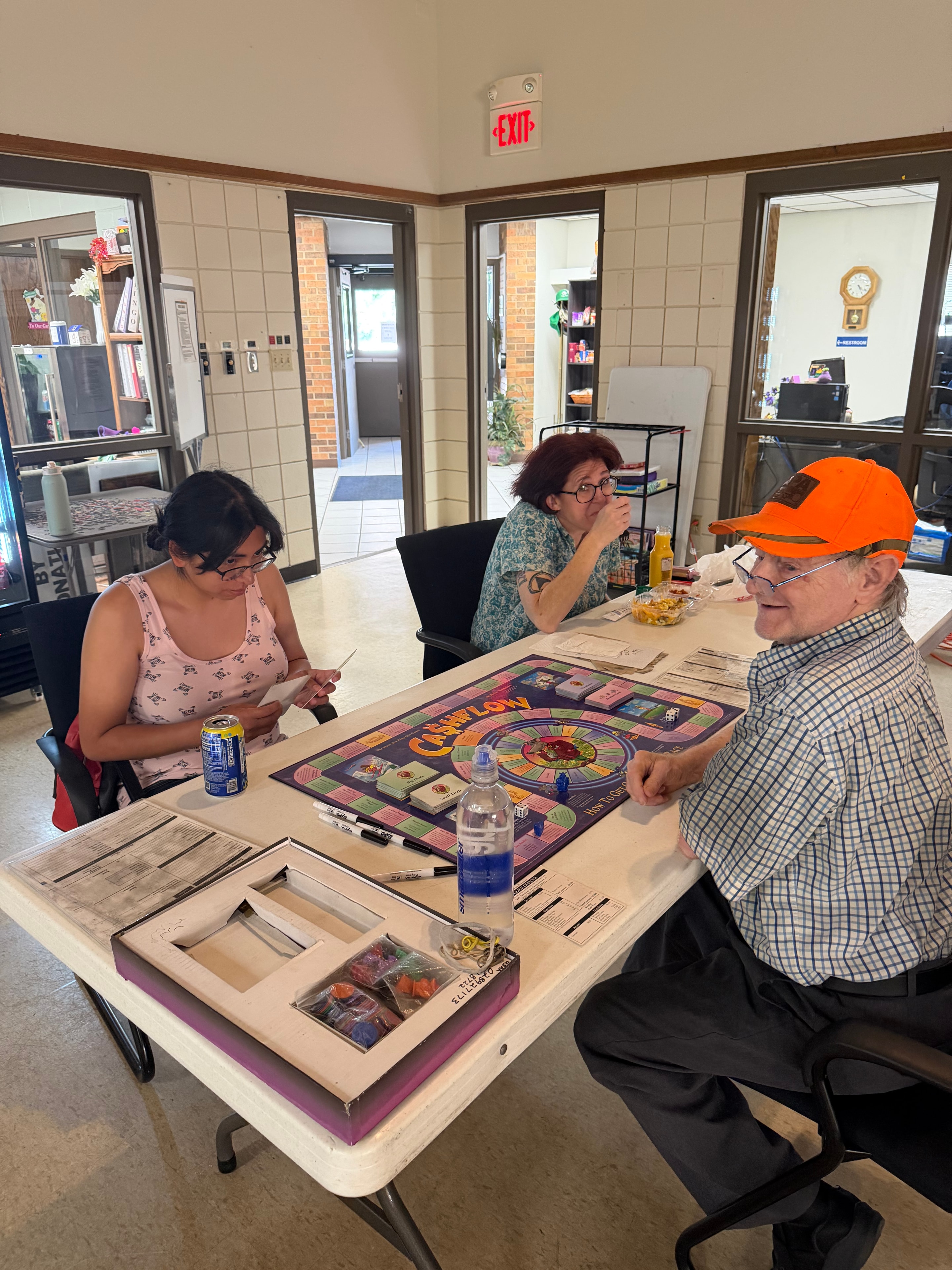 Community members playing Cashflow at Black Hills Side Quest